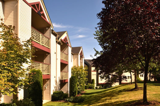 Exterior of balconies, grass lawn and trees