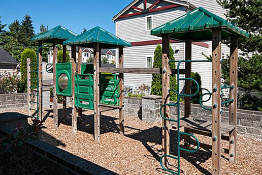 Green playground, slide, climbing equipment