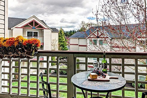 Balcony overlooking lawn, small patio furniture