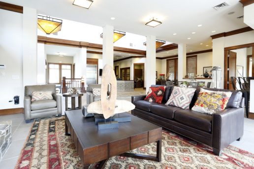 seating area with couch and chair, coffee table, decor