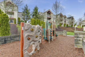 Community Playground, Rock wall, slide, Soft ground from woodchips.