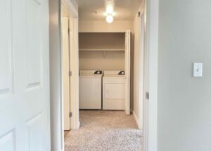 Unit Washer and dryer linen closet, Carpet Flooring.